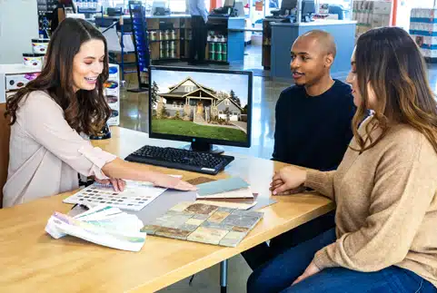 A group of people sitting at a desk