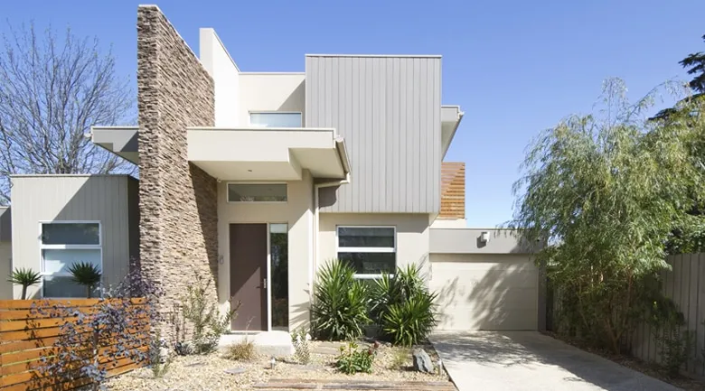 A house with trees in the background