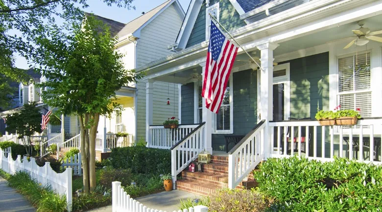 A house with bushes in front of a building