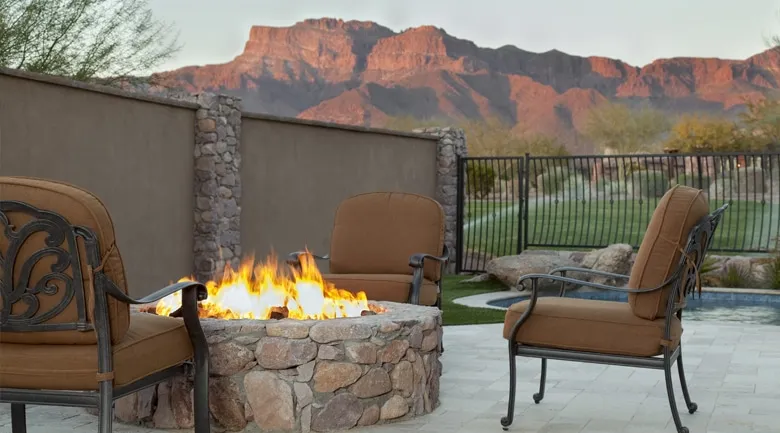 A chair sitting in front of a mountain