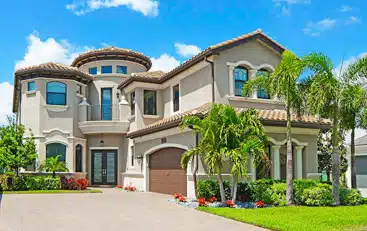 A palm tree in front of a house