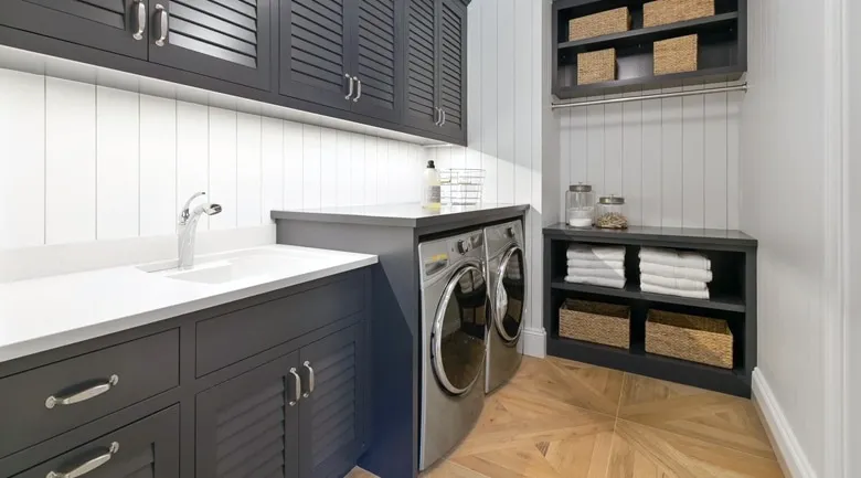 A kitchen with a sink and a window