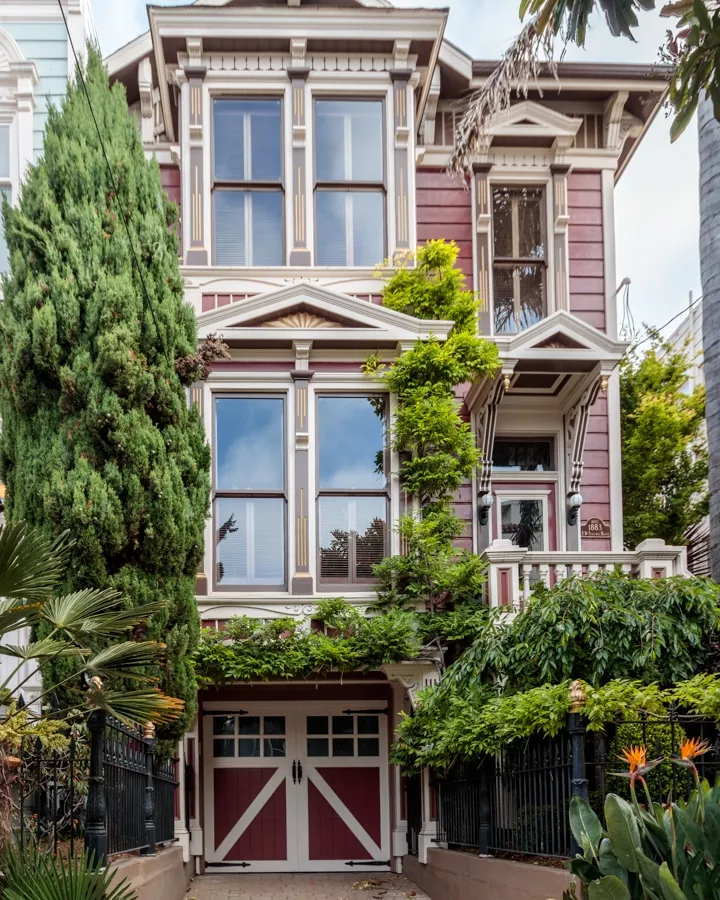 A house with bushes in front of a building