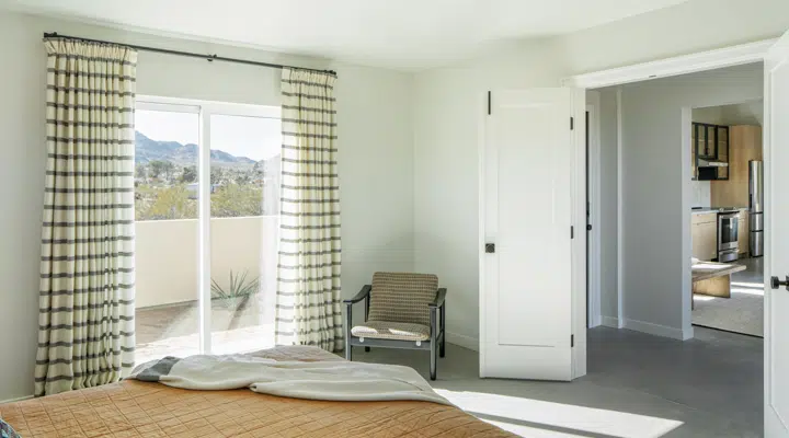 A bedroom with a large window