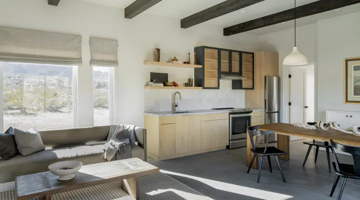 A living room filled with furniture and a large window