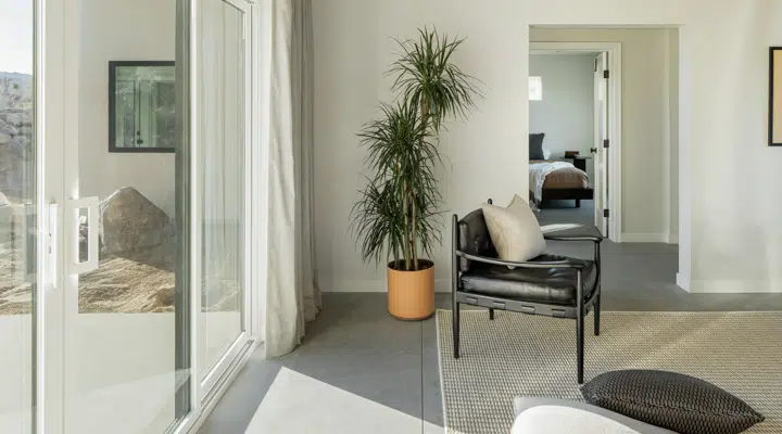 A living room filled with furniture and a large window