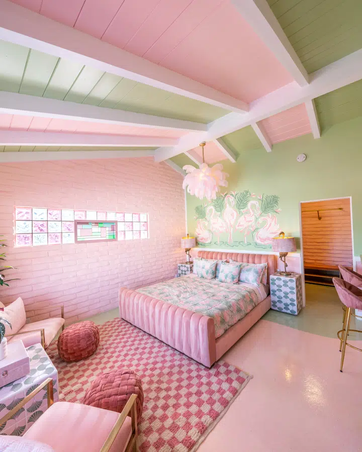 A living room filled with pink flowers on a table