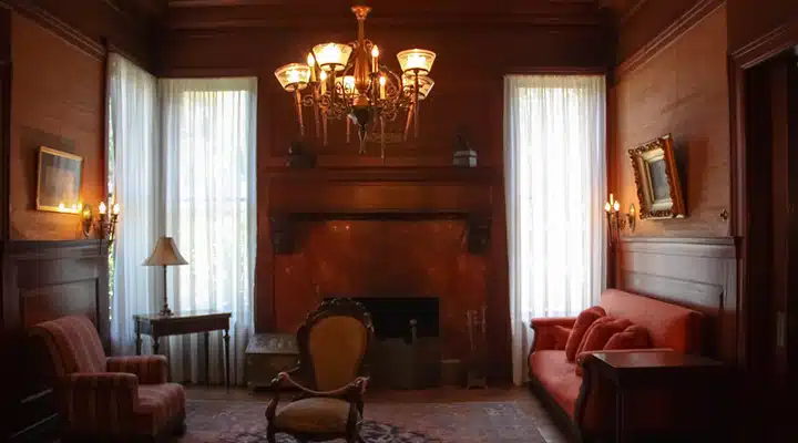 A living room filled with furniture and a fire place sitting in a chair