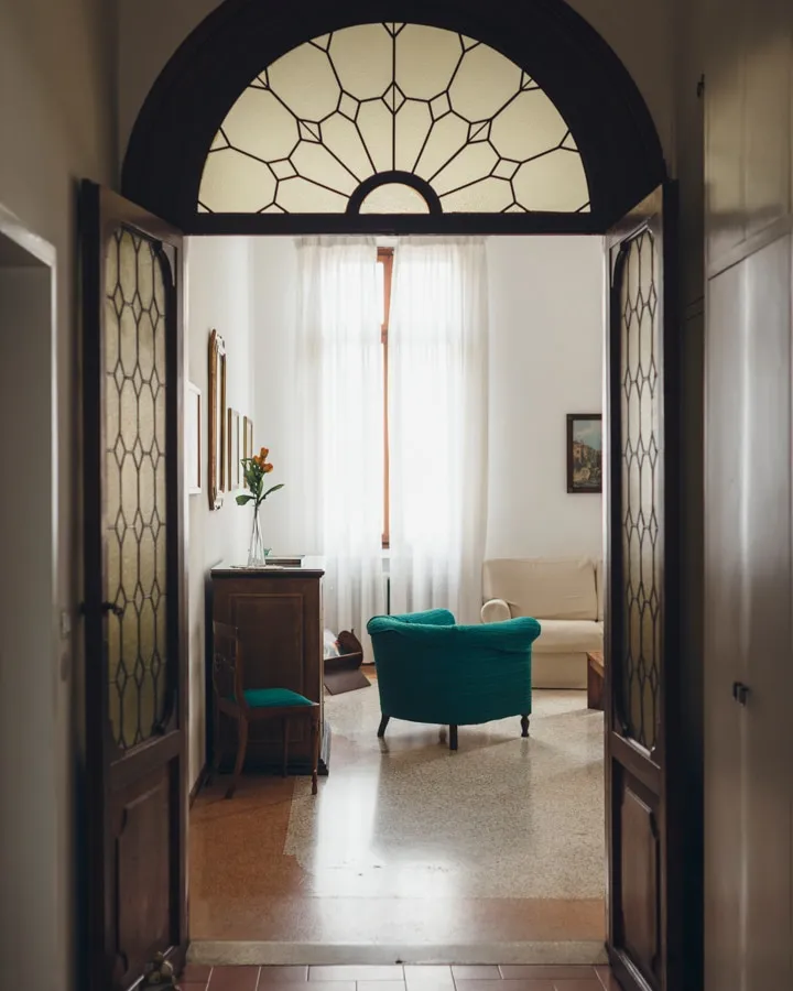 A kitchen with a table in a room