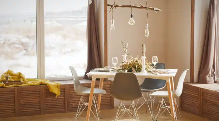 A dining room table in front of a window