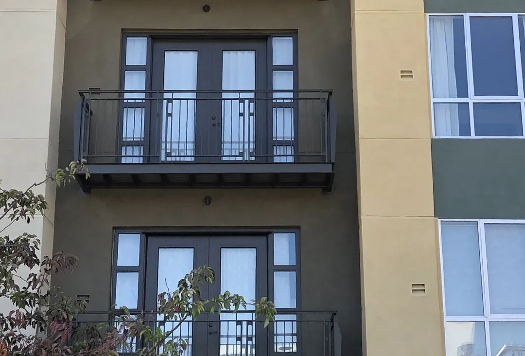 A person standing in front of a window