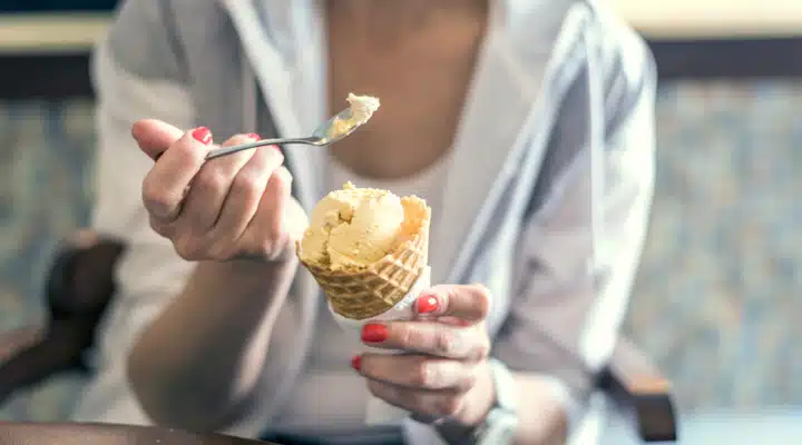 A woman holding a plate of food