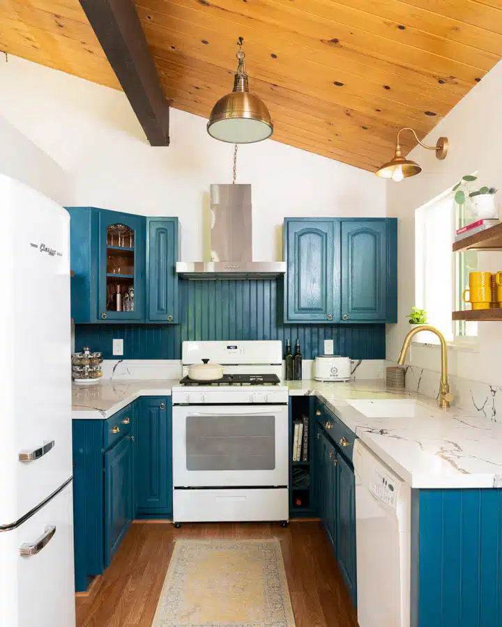 A kitchen with stainless steel appliances and wooden cabinets