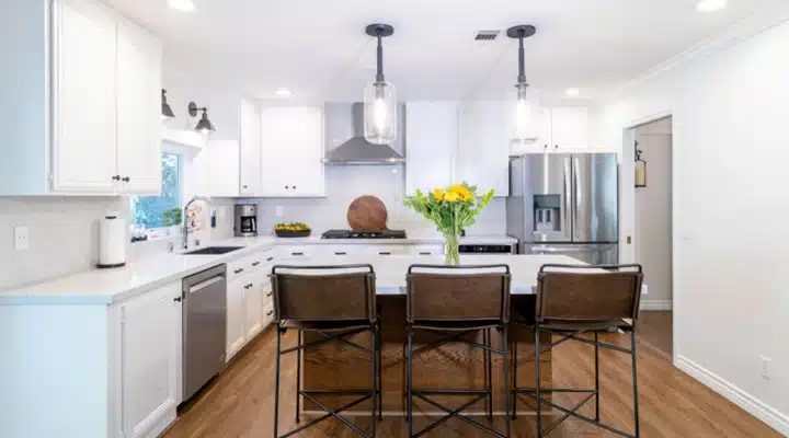 A kitchen with an island in the middle of a room