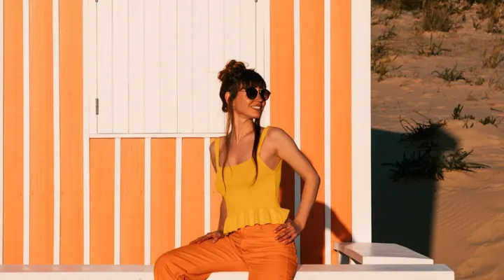 A woman standing in front of a building