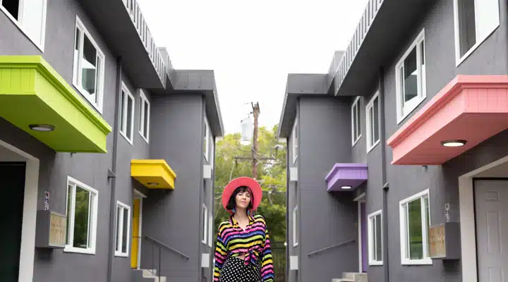 A person standing in front of a building