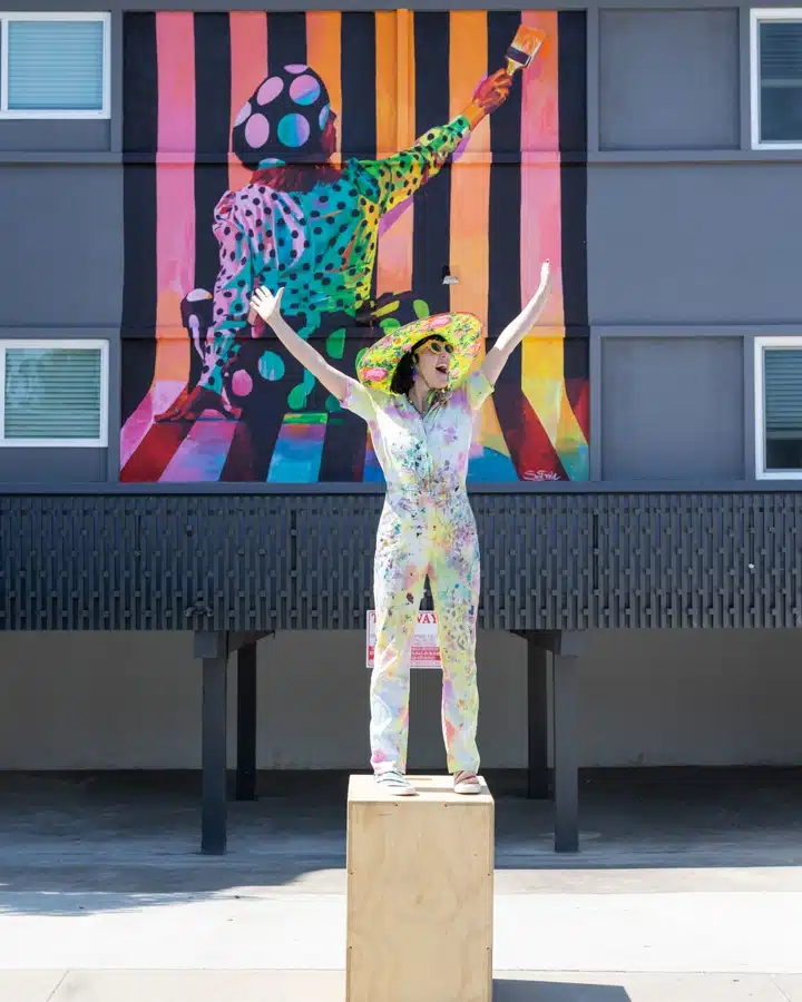 A person standing in front of a statue