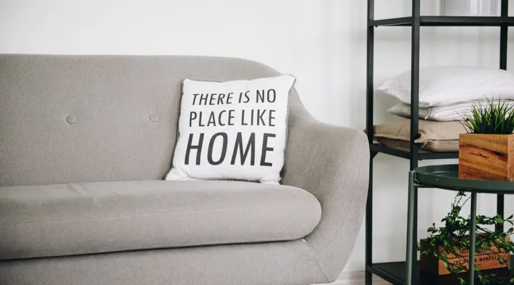 A living room filled with furniture and a lamp