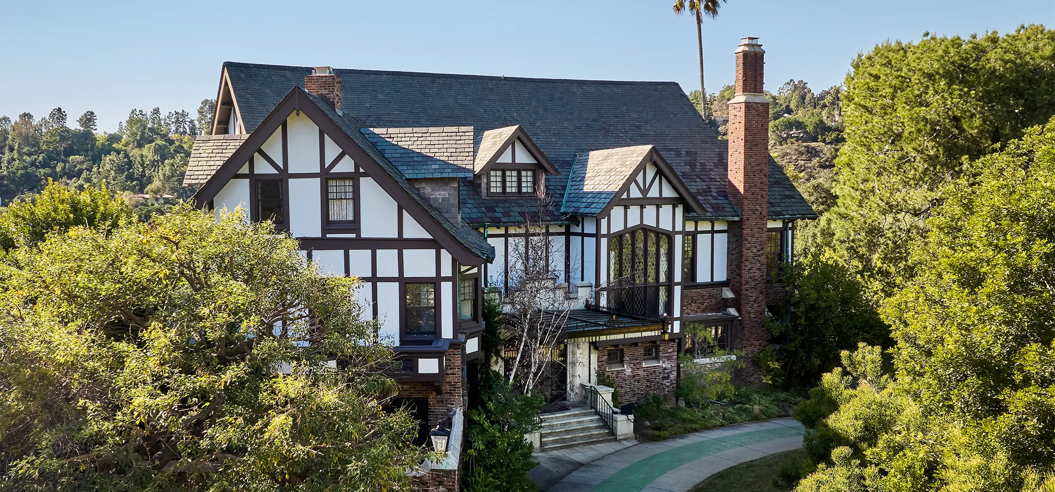 A house with bushes in front of a building