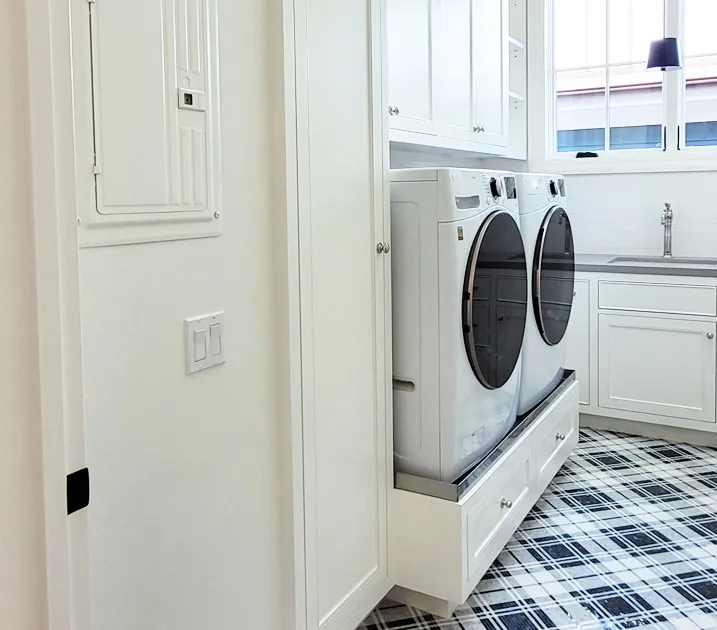 A microwave oven sitting on top of a refrigerator