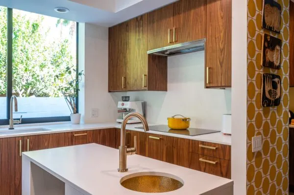 A kitchen with a sink and a window
