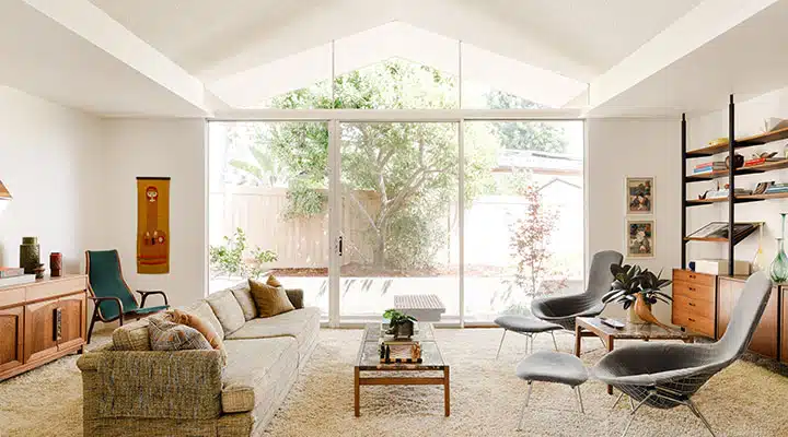 A living room filled with furniture and a fire place