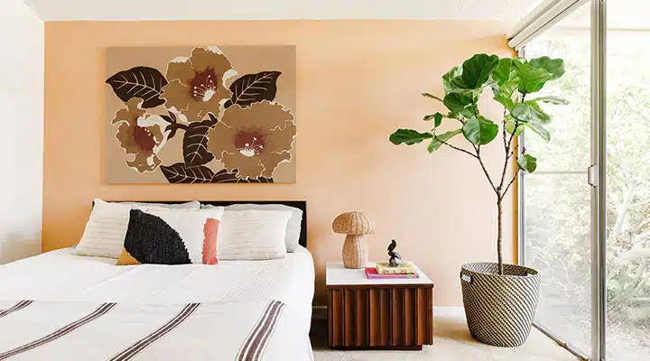 A bed with a lamp on a table