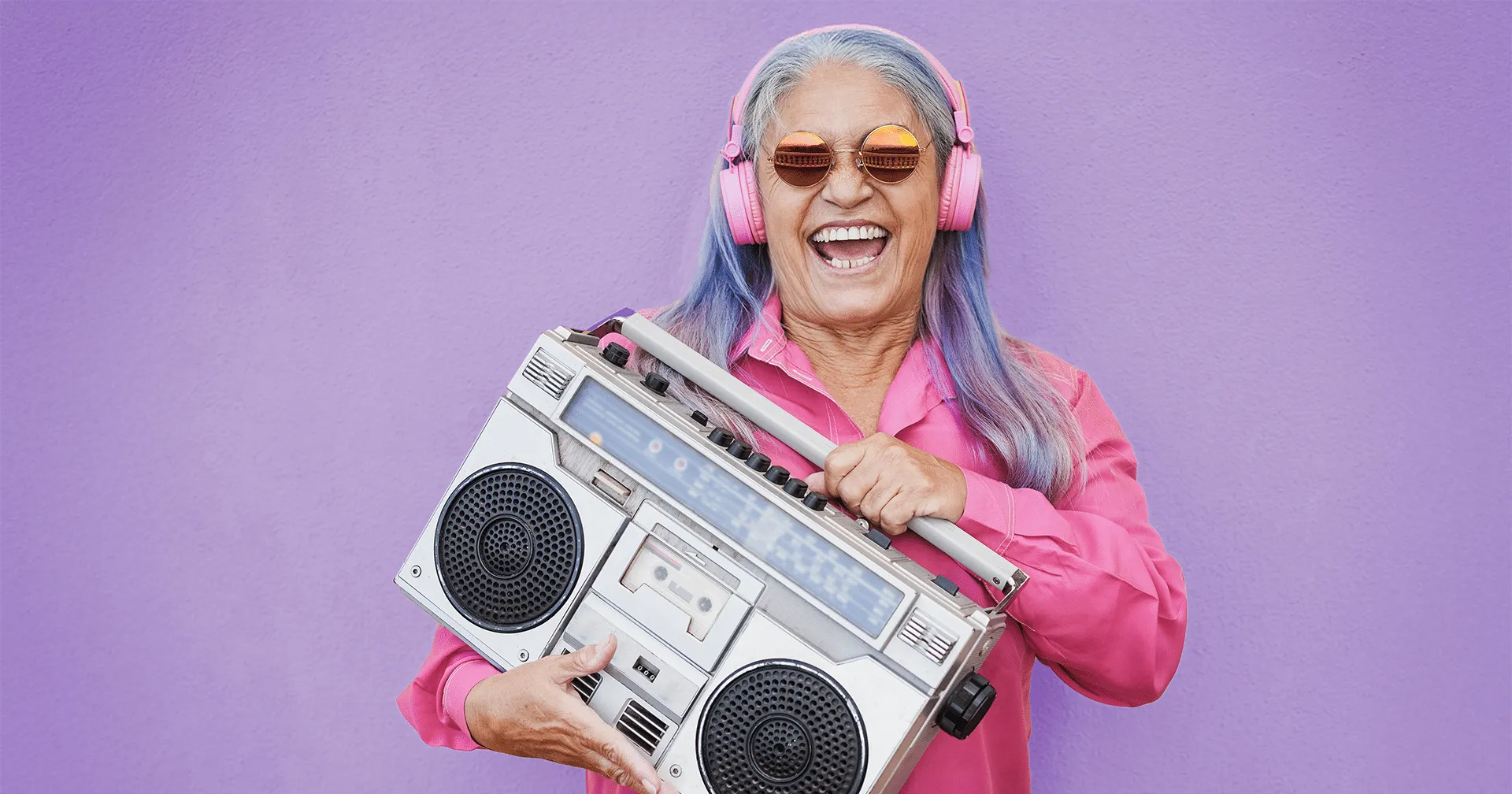 1980s happy-senior-woman-listening-music