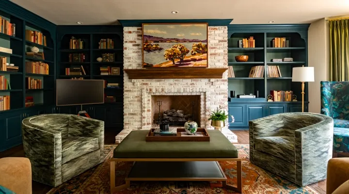 A living room filled with furniture and a fire place