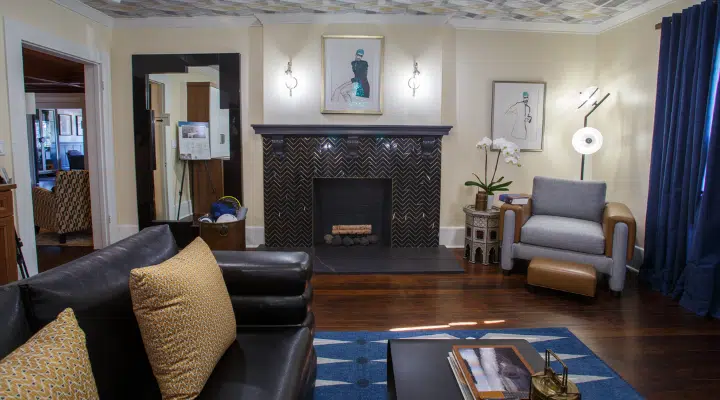 A living room filled with furniture and a fire place