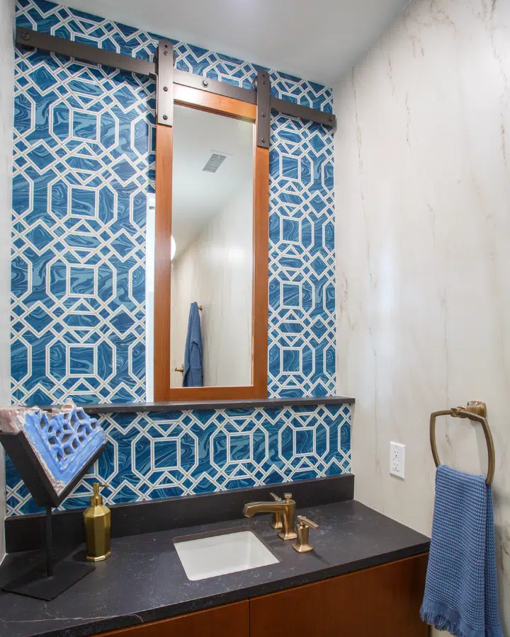 A room with a sink and a mirror